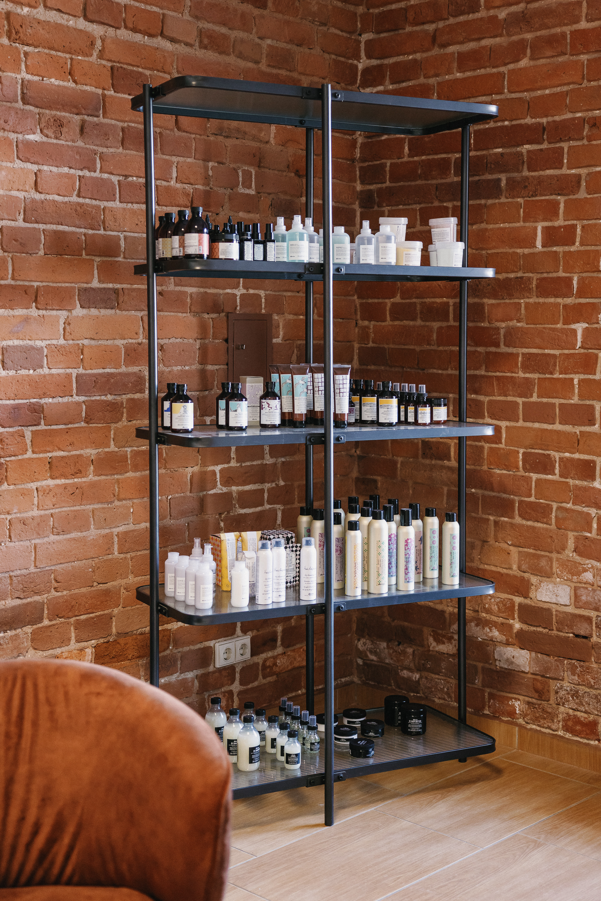 A shelf containing haircare products